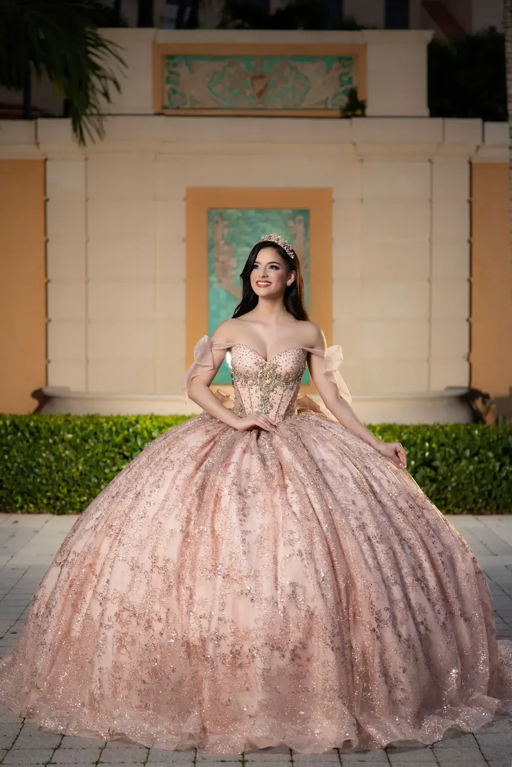model is wearing a light pink quince dress