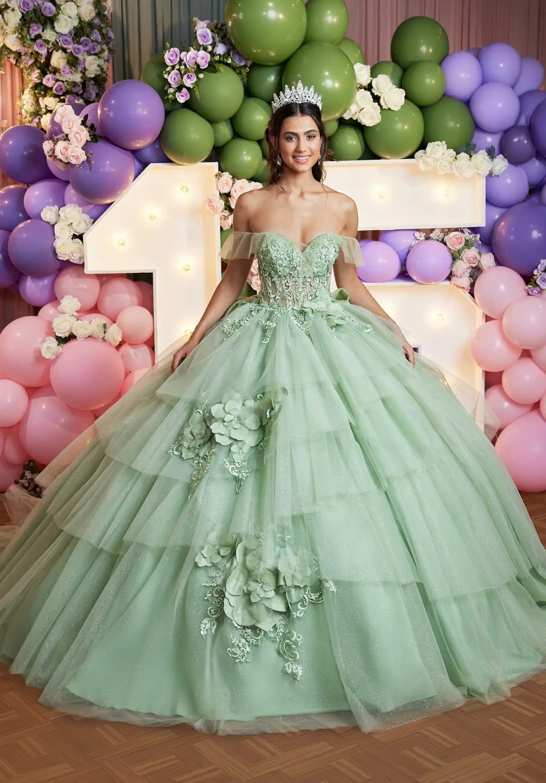 model is wearing a light green off the shoulder quince dress