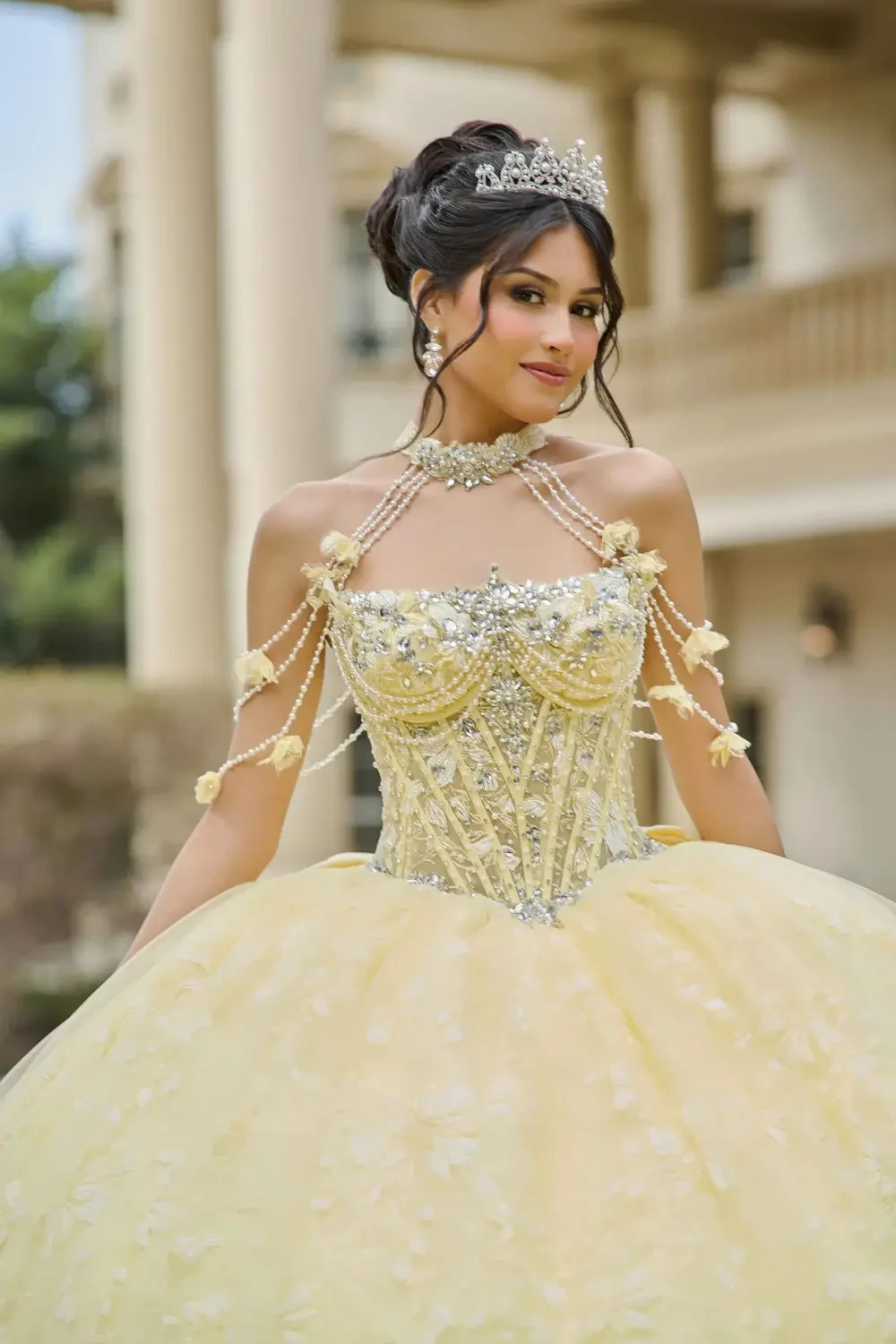 model is wearing a gold quince gown